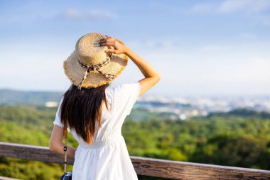 Woman look at the city in Taiwan