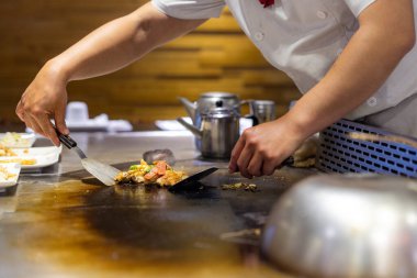 Taiwanese Teppanyaki restaurant grill chicken fillet on pan