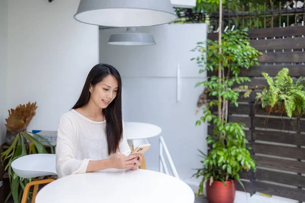 Woman use cellphone for ordering food in cafe