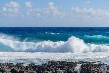 Big sea wave splash over the rock