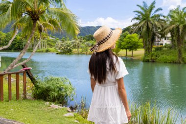 Travel woman go to the lakeside