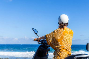 Travel Woman ride a motor bike in liuqiu island at Taiwan