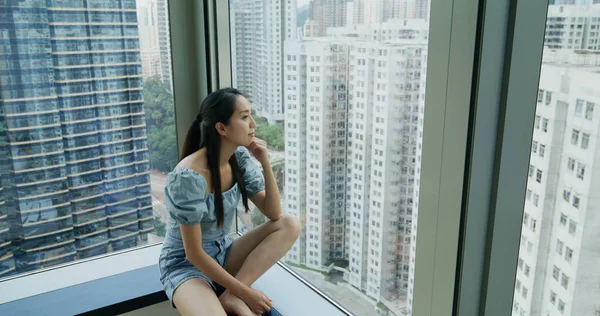 Woman Sit Window Look City View — 스톡 사진