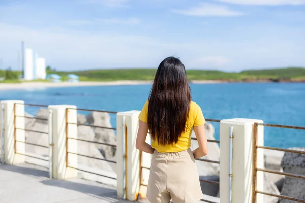 Tourist woman look at the sea in Penghu of Taiwan