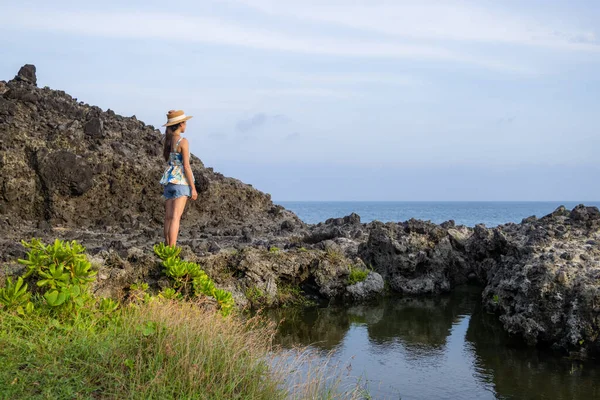 Tourist woman look at the sea