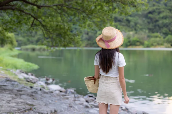 Woman look at the beautiful lake