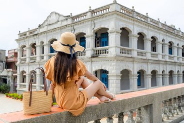 Woman look at the Chen Jing lan Western House in Kinmen