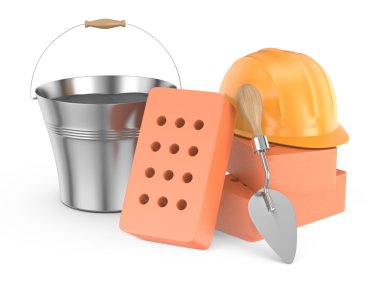 Tuğlalar, mala ve kask yığını