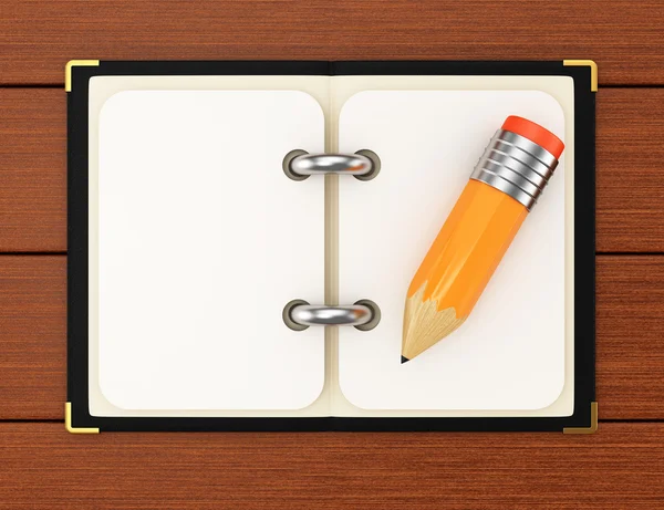 Notepad and pencil on wooden background — Stock Photo, Image