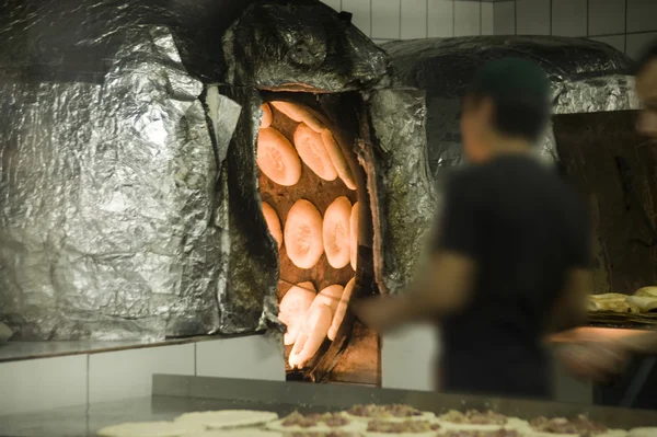 Asia. Baking of bread in clay furnaces — Stock Photo, Image