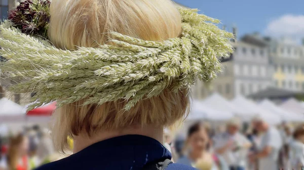 Riga. Wreath of ears of wheat on the girl\'s head during the celebration of the summer solstice.