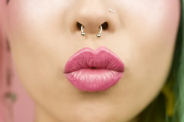 Young woman puckering her lips — Stock Photo, Image