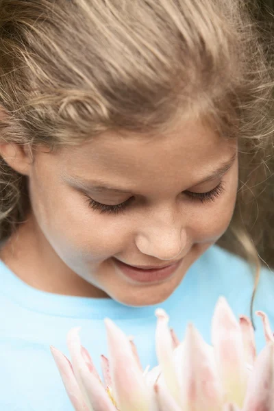 Girl Smelling Flower — Stock Photo, Image