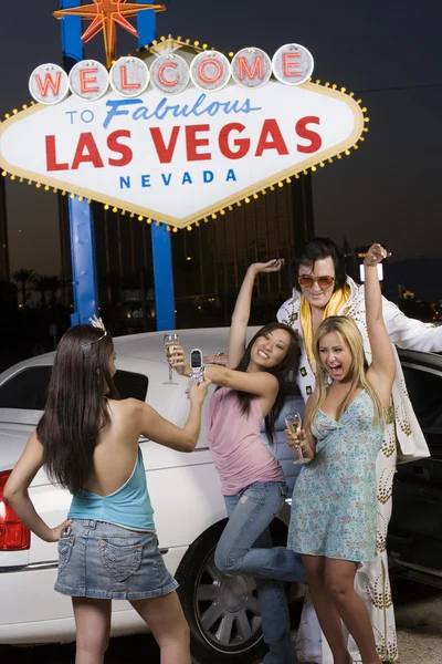 Woman photographing friends — Stock Image Woman photographing friends Stock Image