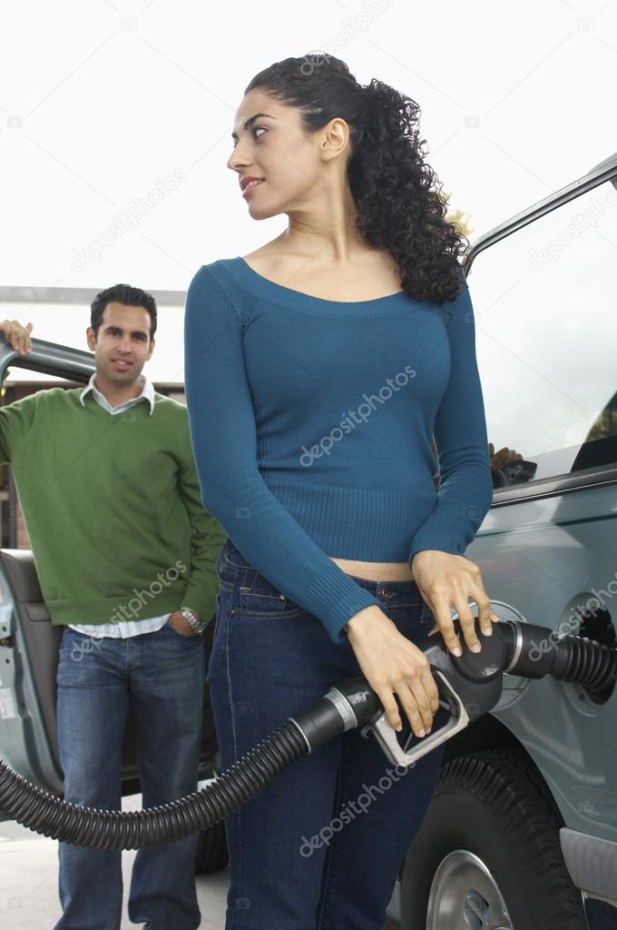 Woman Refueling Car Tank
