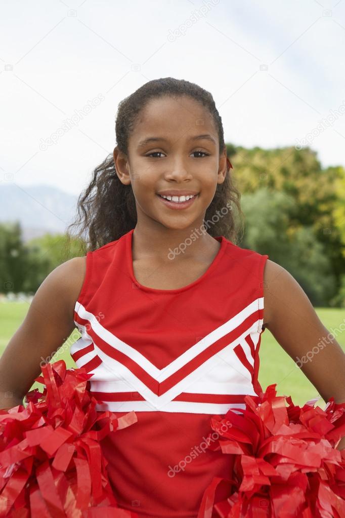 Girl Cheerleader On Soccer Field