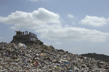Digger At Landfill Site clipart