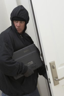 Burglar Stealing Laptop clipart