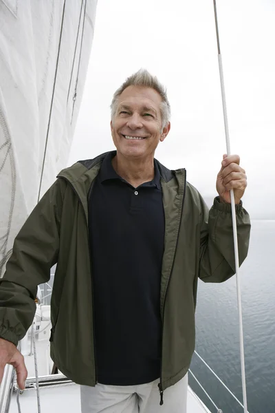 Senior Man holding Rope On Sailboat — Stock Photo, Image