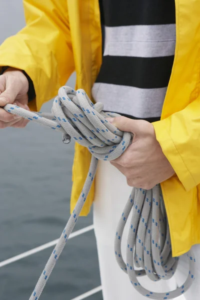 Midsection Of Man Tying Rope On Sailboat — Stock Photo, Image