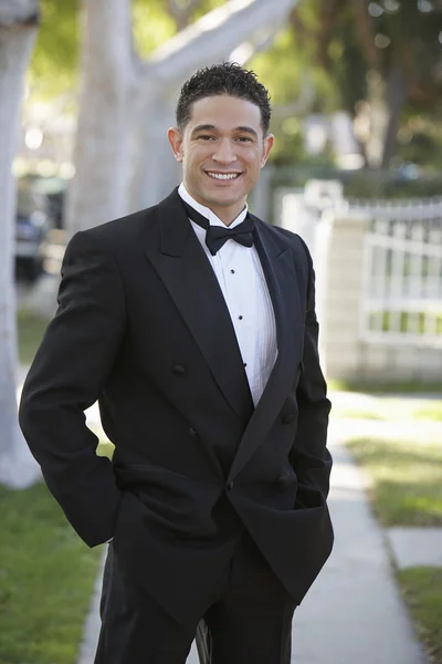 Young Man In Tuxedo Standing With Hands In Pocket At Quinceanera — Stock Photo, Image