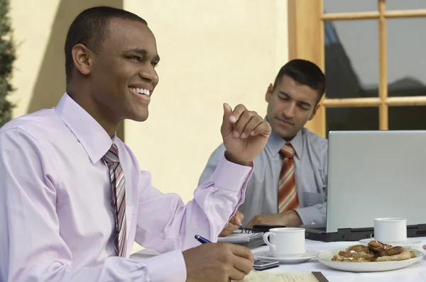 Businessmen Working At Outdoor Cafe Table — Stock Photo, Image