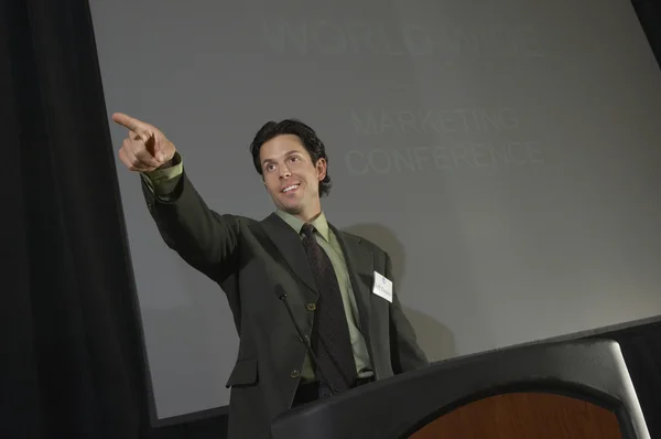 Businessman Pointing While Giving A Lecture — Stock Photo, Image
