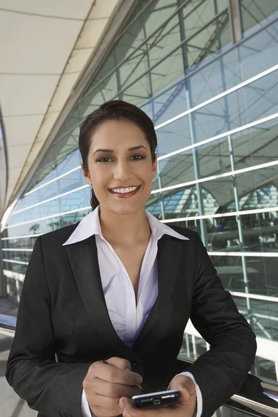 Beautiful Businesswoman Using PDA — Stock Photo, Image