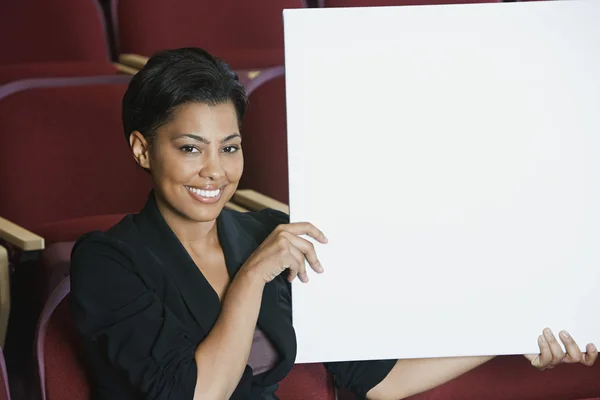Businesswoman Holding Blank Placard — Stock Photo, Image