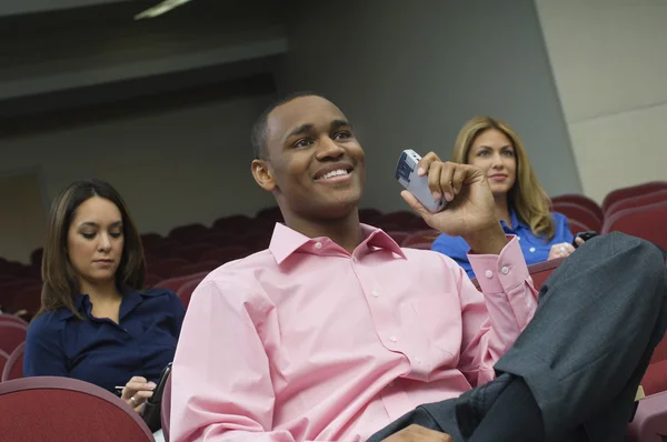 Business Sitting In Auditorium — Stock Photo, Image