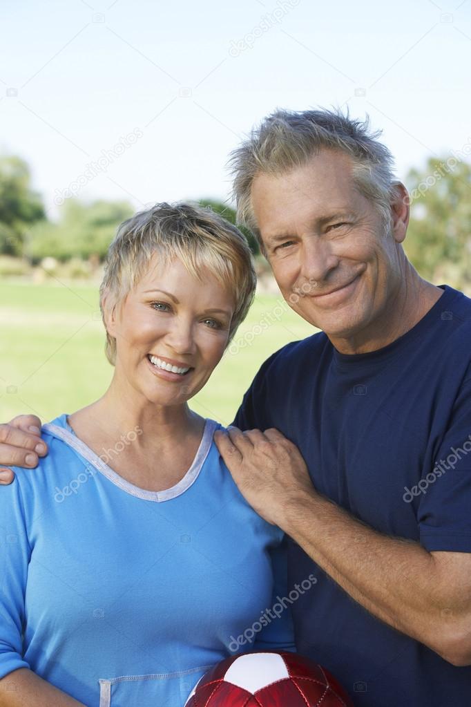 Couple With Soccer Ball In Park