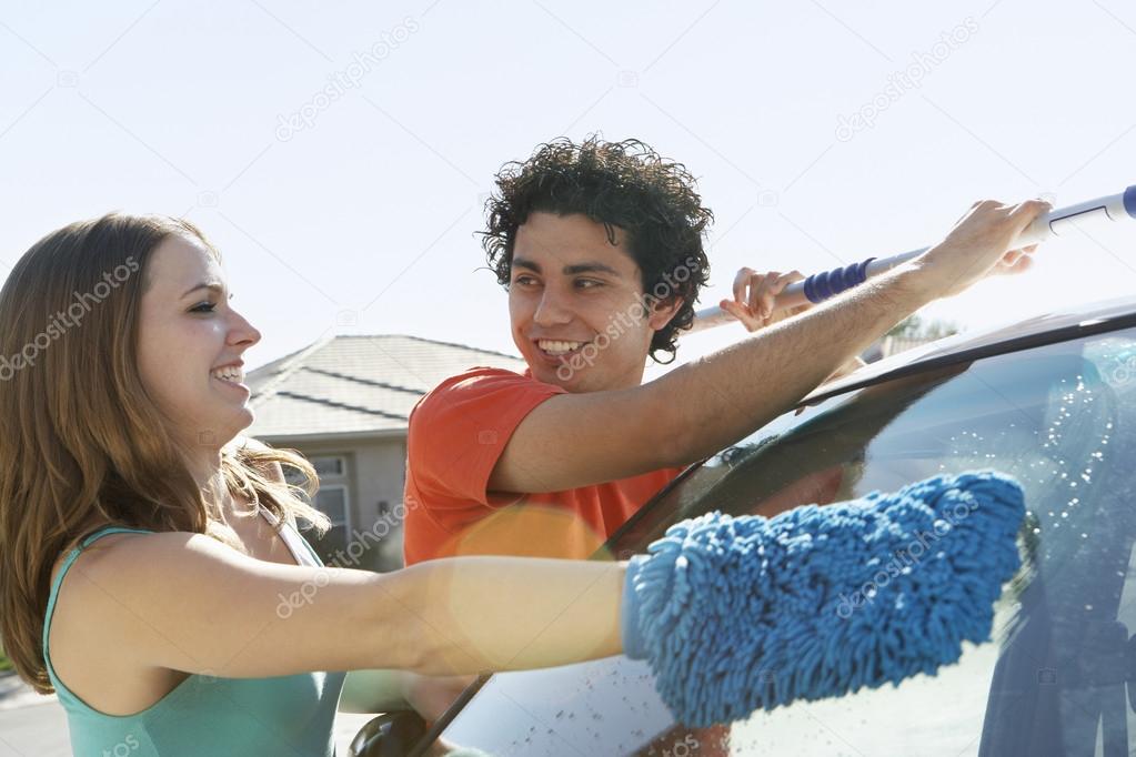 Couple Washing Car