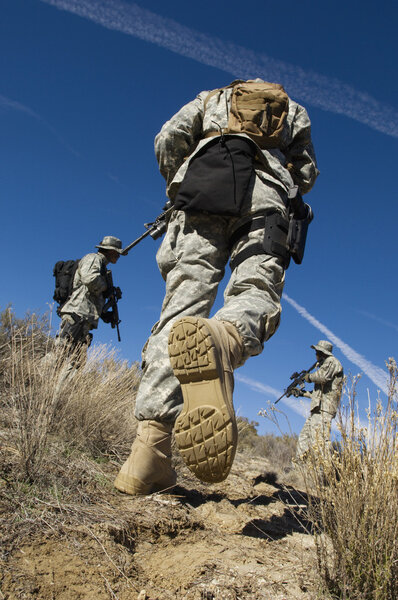 Soldiers Walking In Field