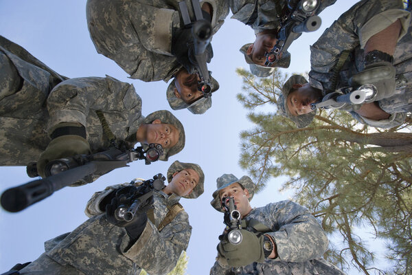 Low Angle Portrait Of Armed Soldiers