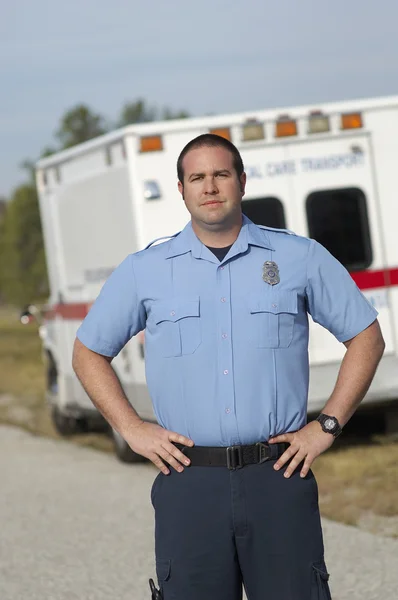 Paramedic In Front Of Ambulance Stock Picture