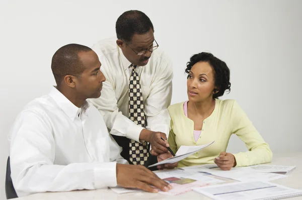 Advisor Explaining Financial Plans To Couple — Stock Photo, Image