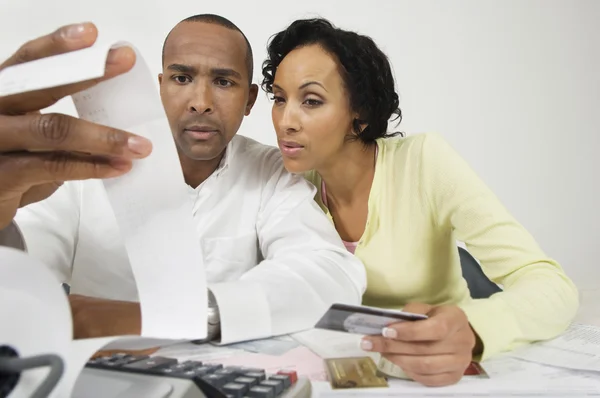 Couple Looking At Expense Receipt At Home — Stock Photo, Image