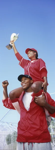 Baseball players with trophy — Stock Photo, Image