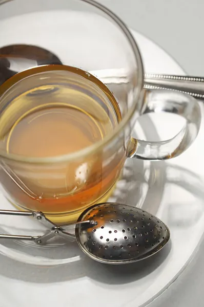 Tea Cup With Strainer In Saucer — Stock Photo, Image