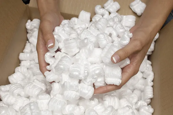 Hands Holding Heap Of Packing Peanuts — Stock Photo, Image