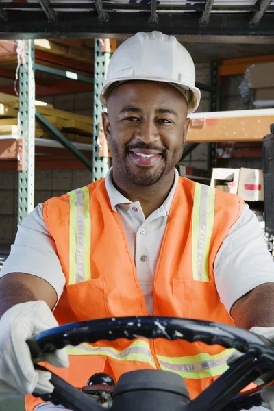 Confident Industrial Worker Driving Forklift At Workplace — Stock Photo, Image