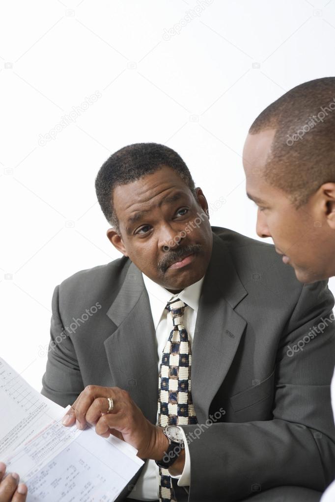 Accountant And Client Going Over Bills