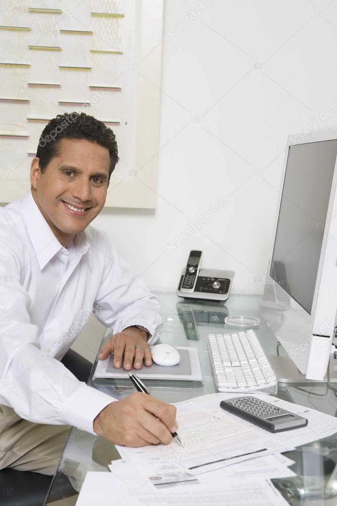 Businessman Working At Desk