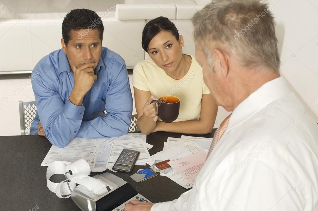 Financial Advisor In Discussion With Clients