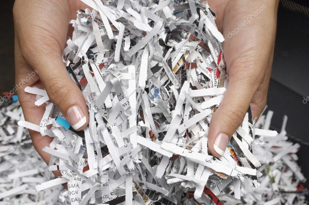 Female Hands With Shredded Papers