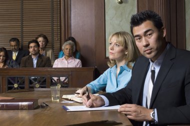 Defense Lawyer With Client In Court clipart