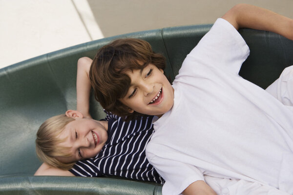 happy little boys on slide