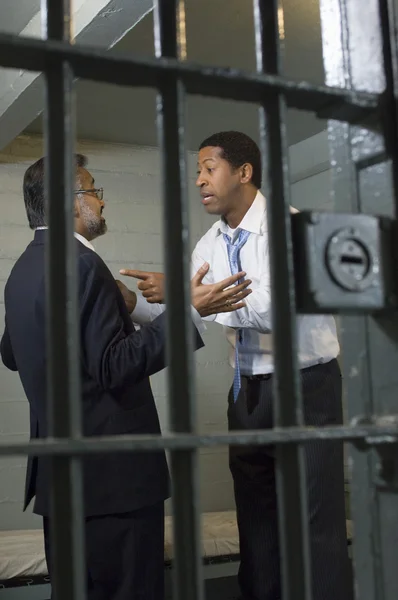 Two Men Arguing In Prison Cell — Stock Photo, Image