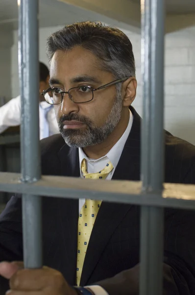 Man In Spectacles Behind Bars — Stock Photo, Image