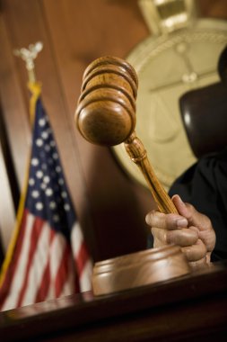 Judge Striking Gavel In Courtroom clipart